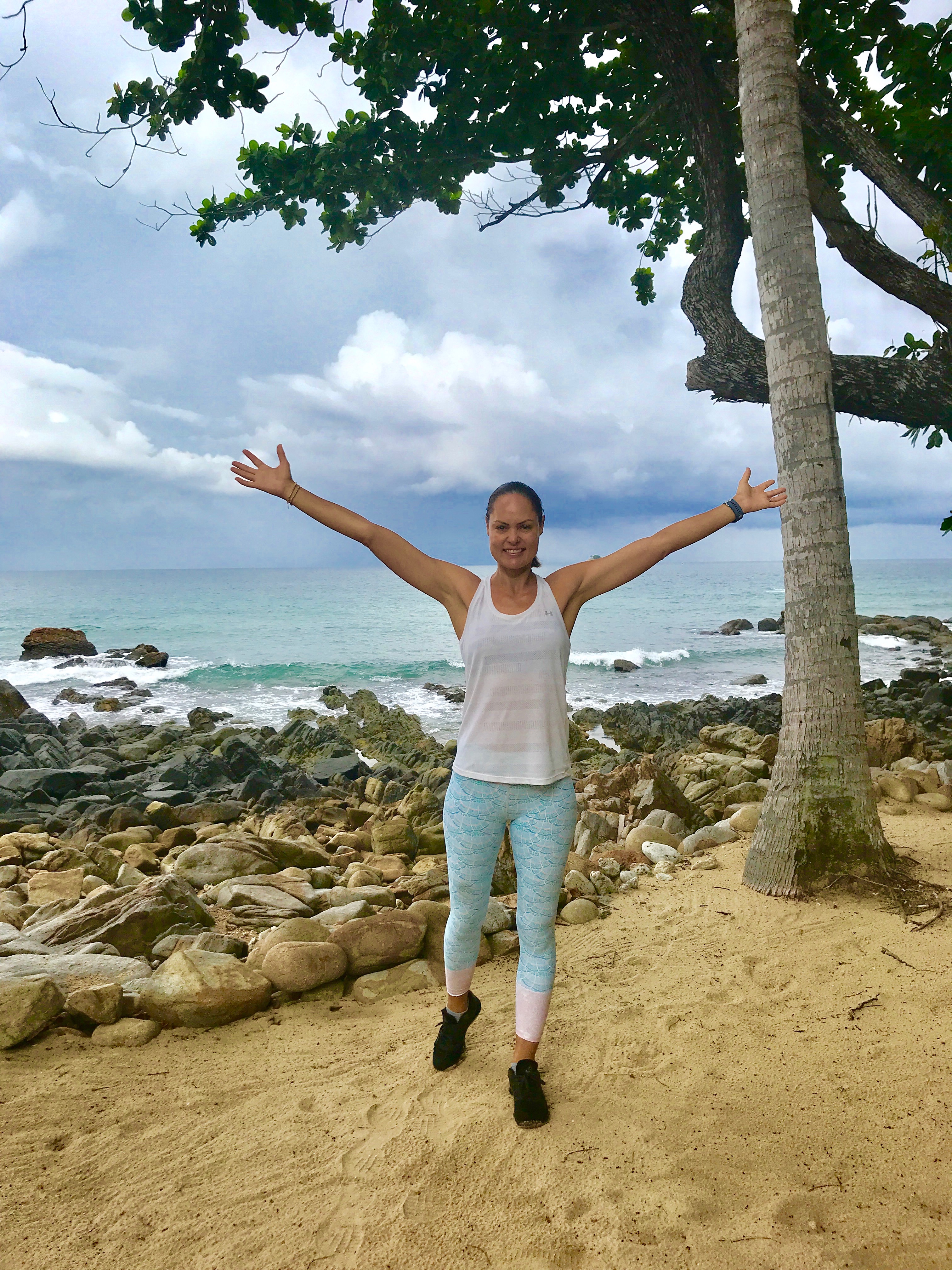 zoe bingley pullin with her arms out in front of a beach on making healthy changes